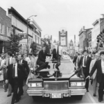 July 31, 1979 photo of a President Carter motorcade in  Bardstown, Ky.  Bobby DeProspero, Phil Ley, Jerry Parr, Larry Porte, Dick Griffin, and Joe Trainor are in picture left to right.